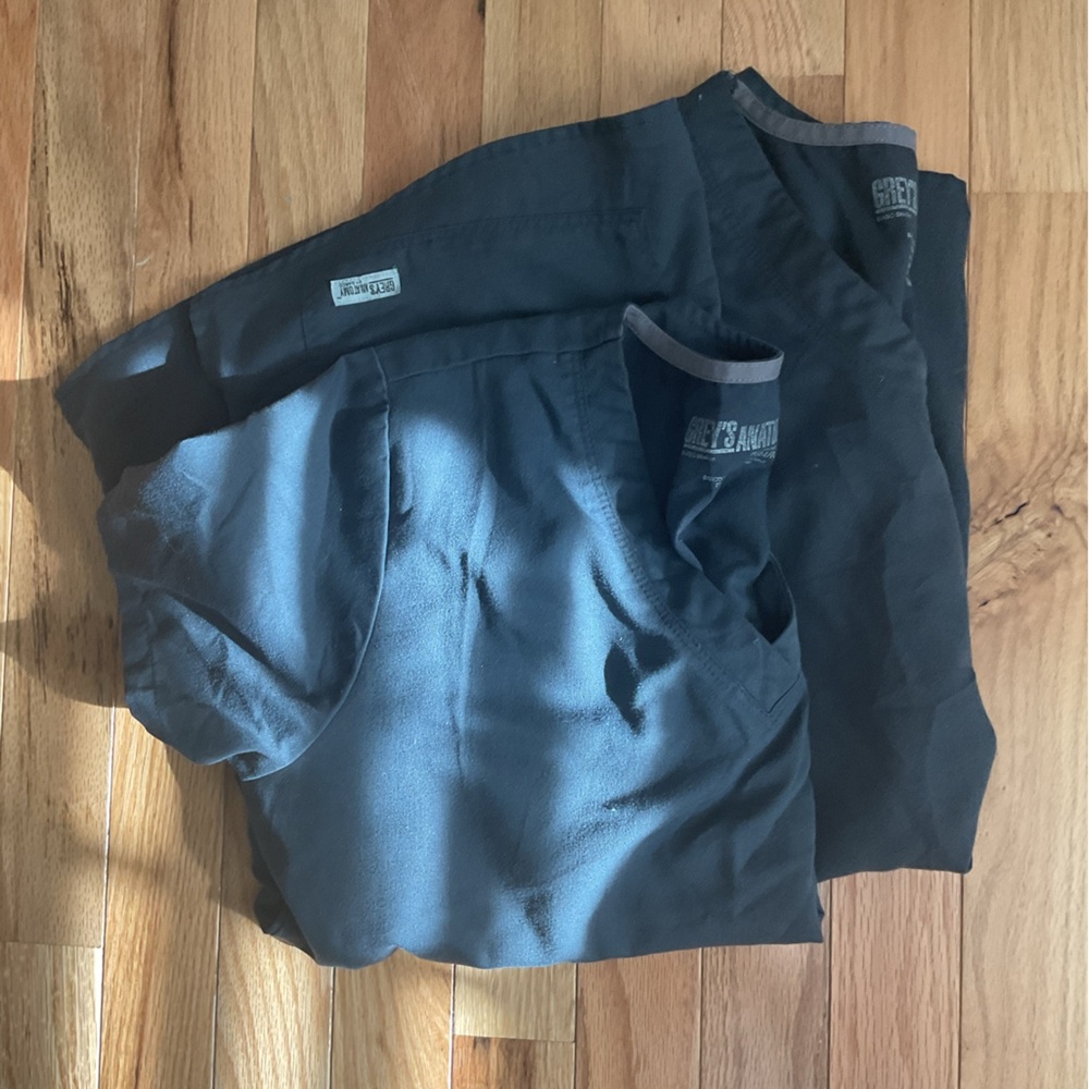 Two pewter Greys Anatomy scrub tops.